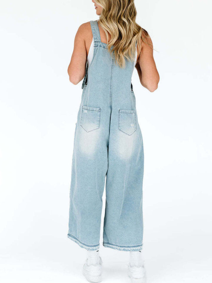 Distressed wide leg denim overalls with adjustable straps