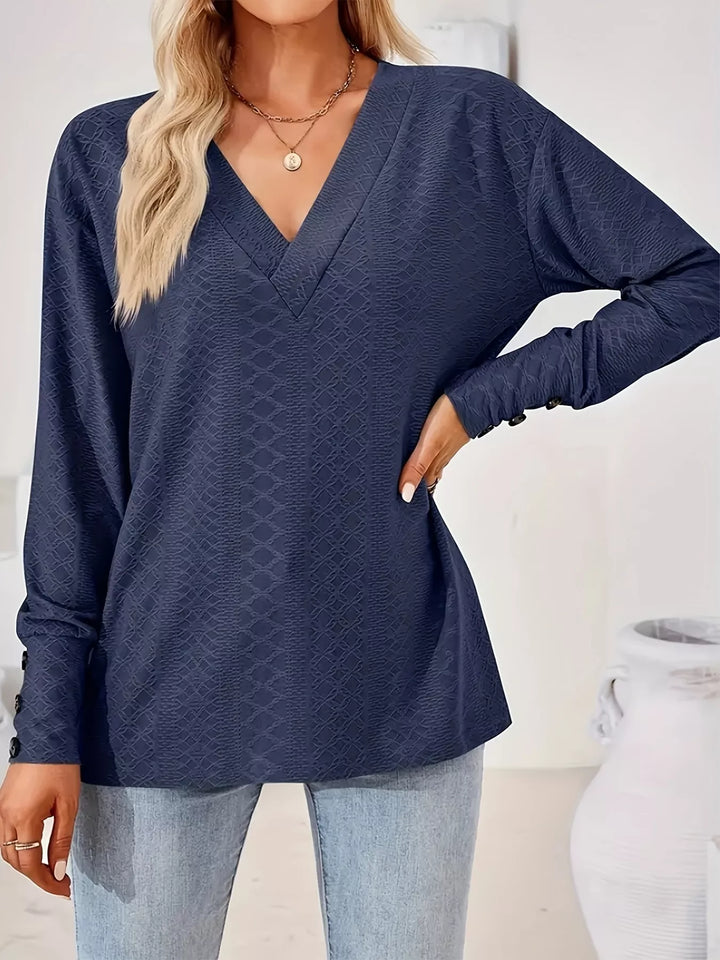 Plus size textured V-neck long sleeve top with button cuffs