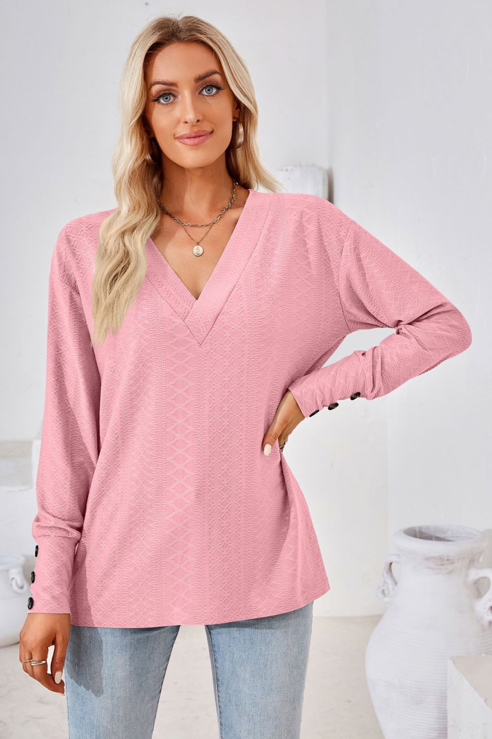 Textured knit V-neck long sleeve top with button cuffs
