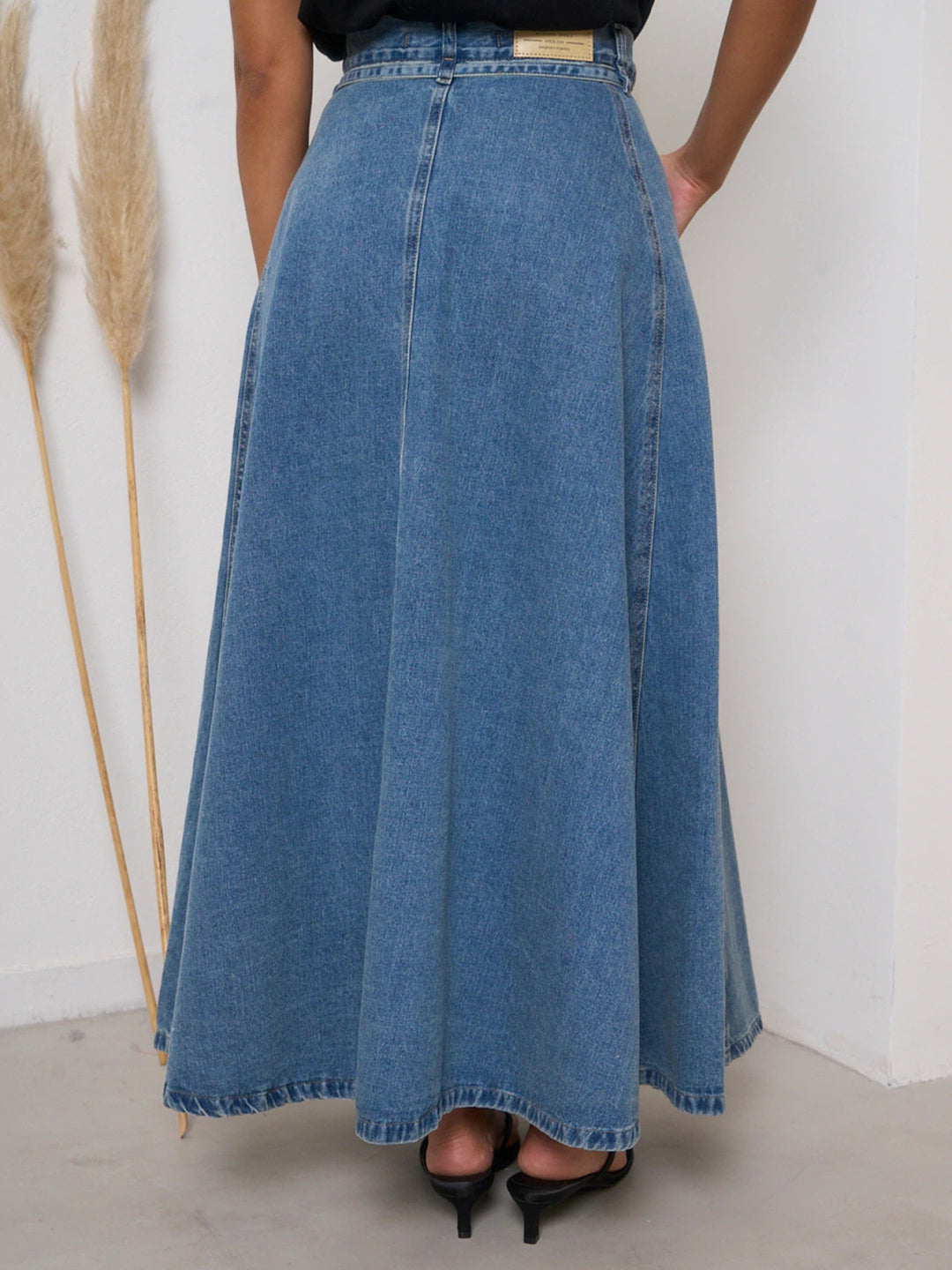 High-waisted belted A-line maxi denim skirt