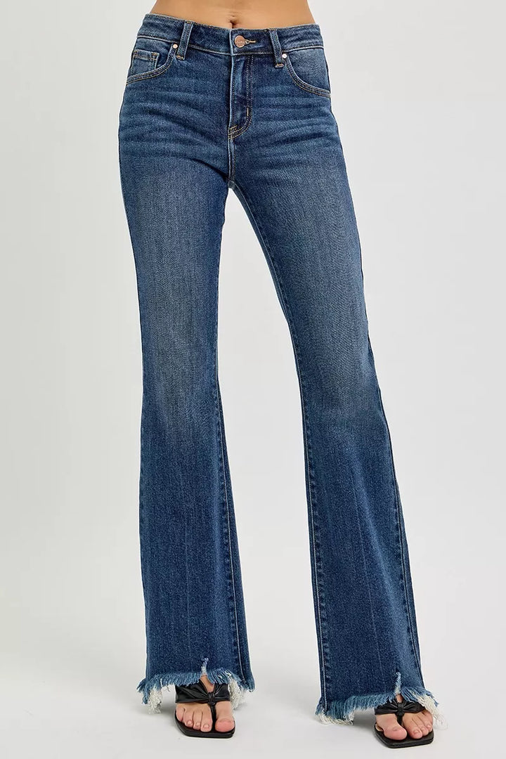 Mid-rise flare jeans with raw frayed hem in stretch denim