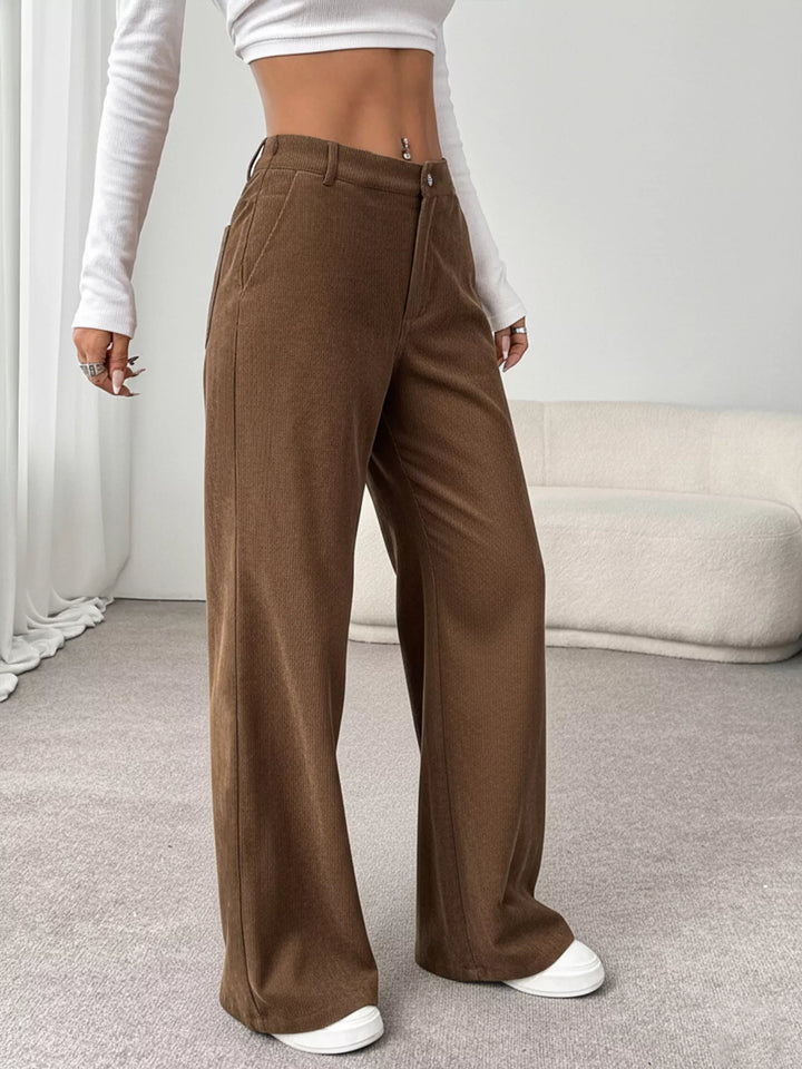 Wide-leg high-rise pants with button waist and deep pockets