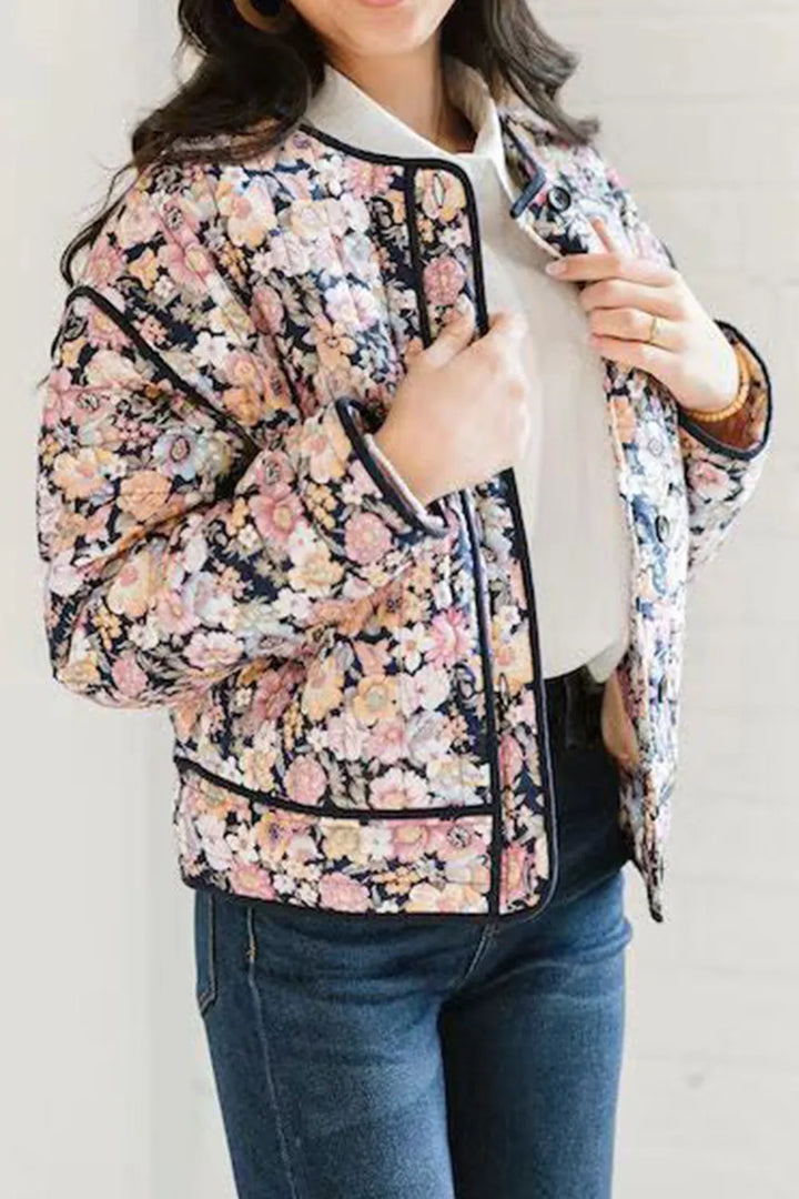 Quilted floral jacket with contrast piped trim and round neck