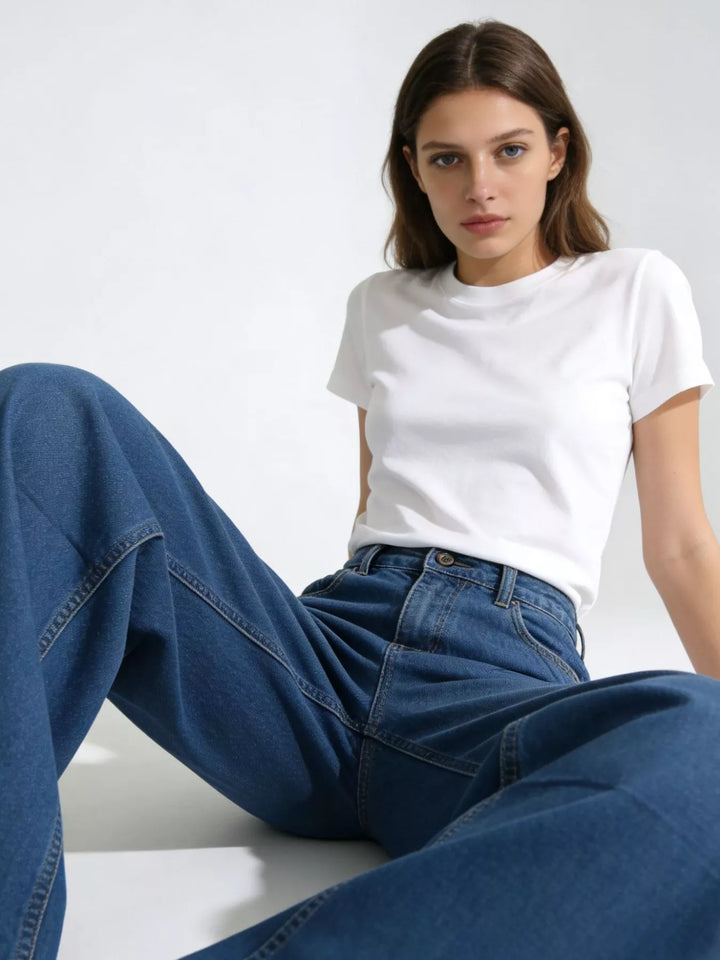 High-rise wide-leg jeans in faded mid-wash denim
