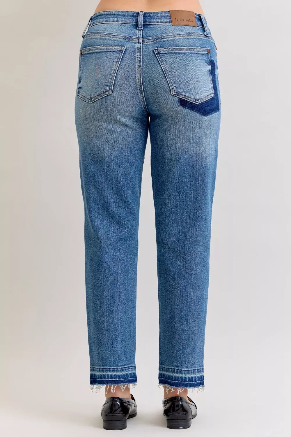 Distressed mid-rise boyfriend jeans with released raw hem