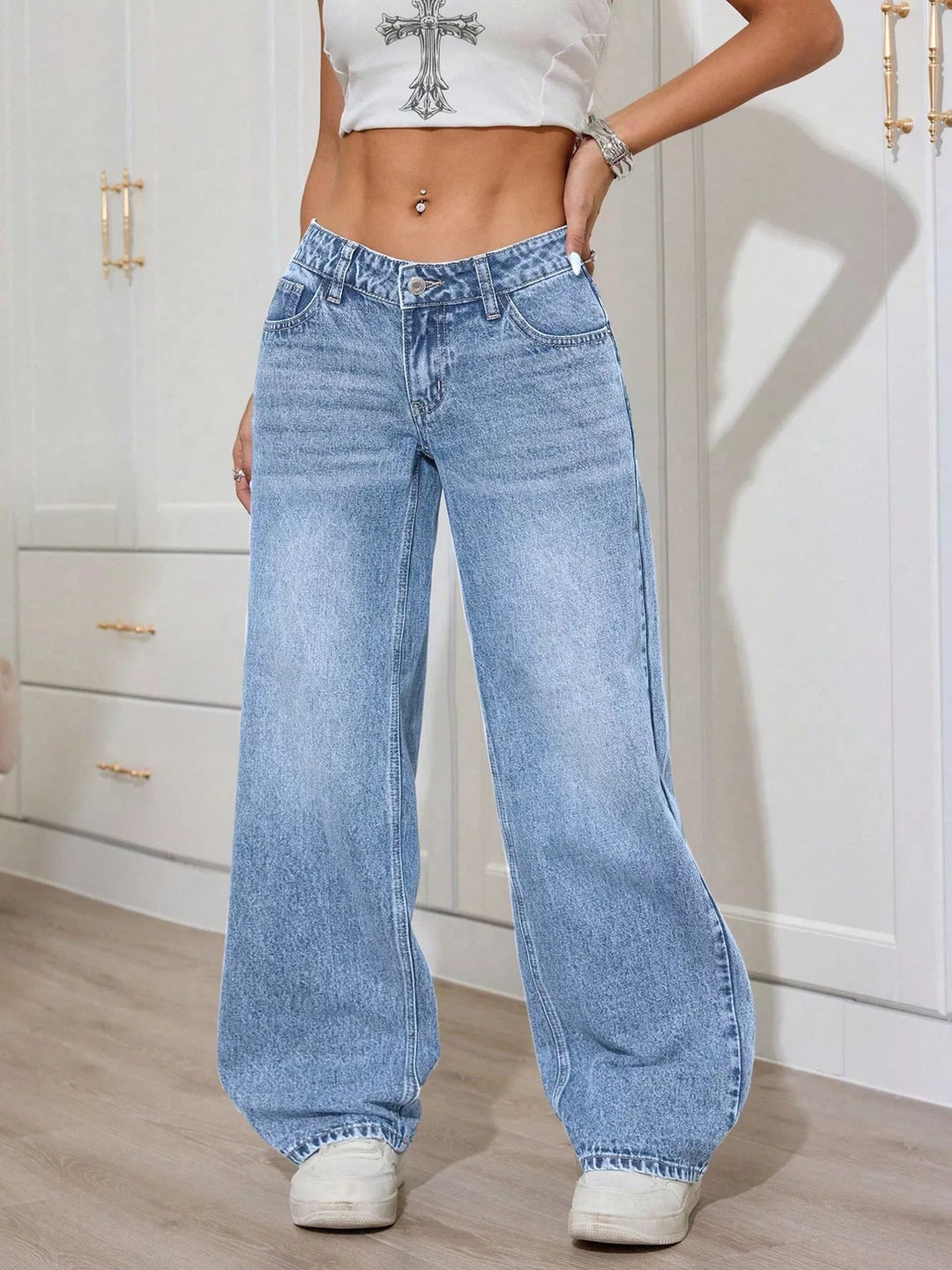 Low-rise washed wide leg jeans with faded whiskering