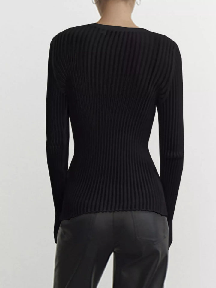 Sheer ribbed knit long sleeve top with flared cuffs