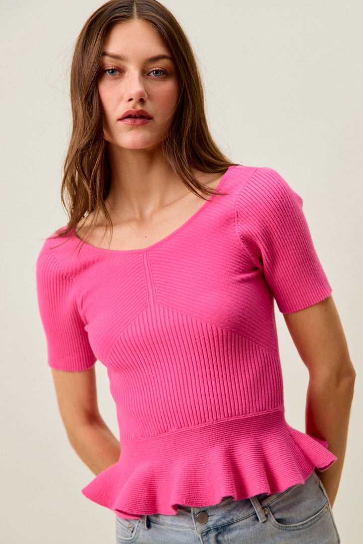 Ribbed knit peplum top with short sleeves and scoop neck
