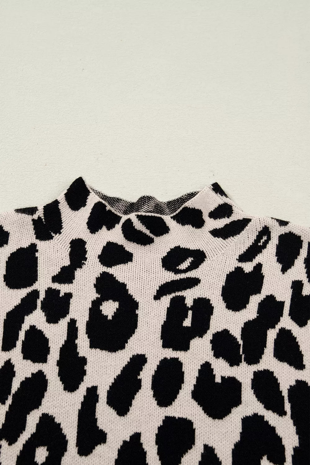 Leopard print mock neck cap sleeve sweater top