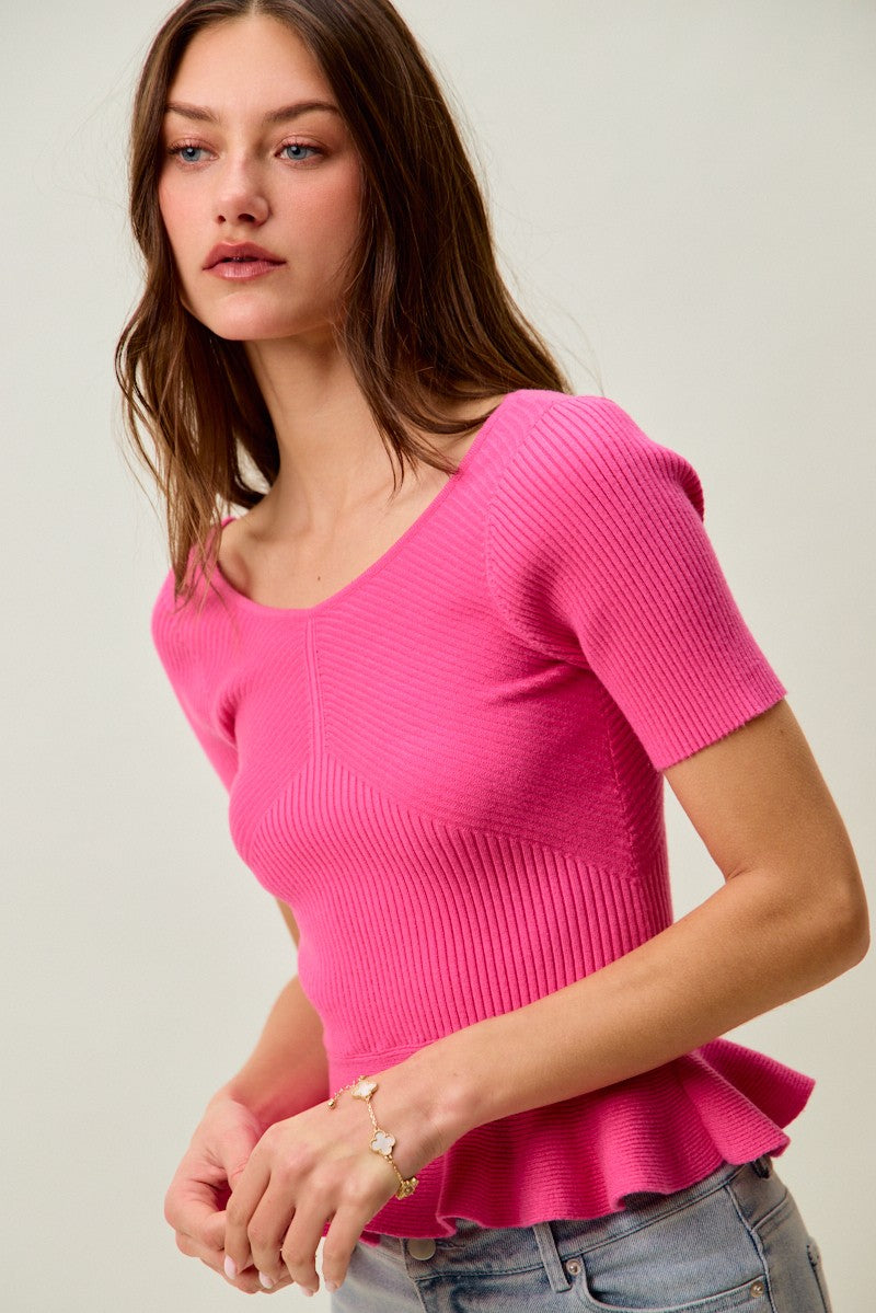 Ribbed knit peplum top with short sleeves and scoop neck