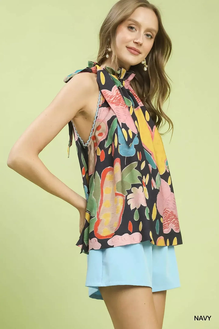 Floral halter top with ruffled neckline and lace trim