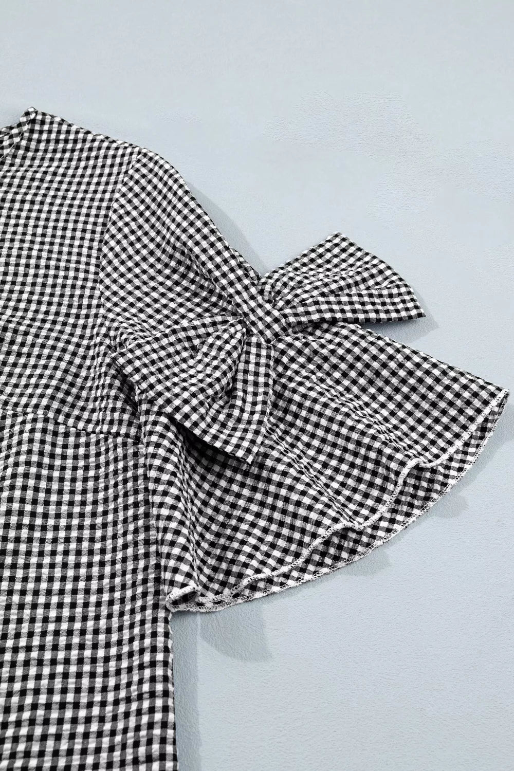 Gingham ruffle half-sleeve crew neck blouse