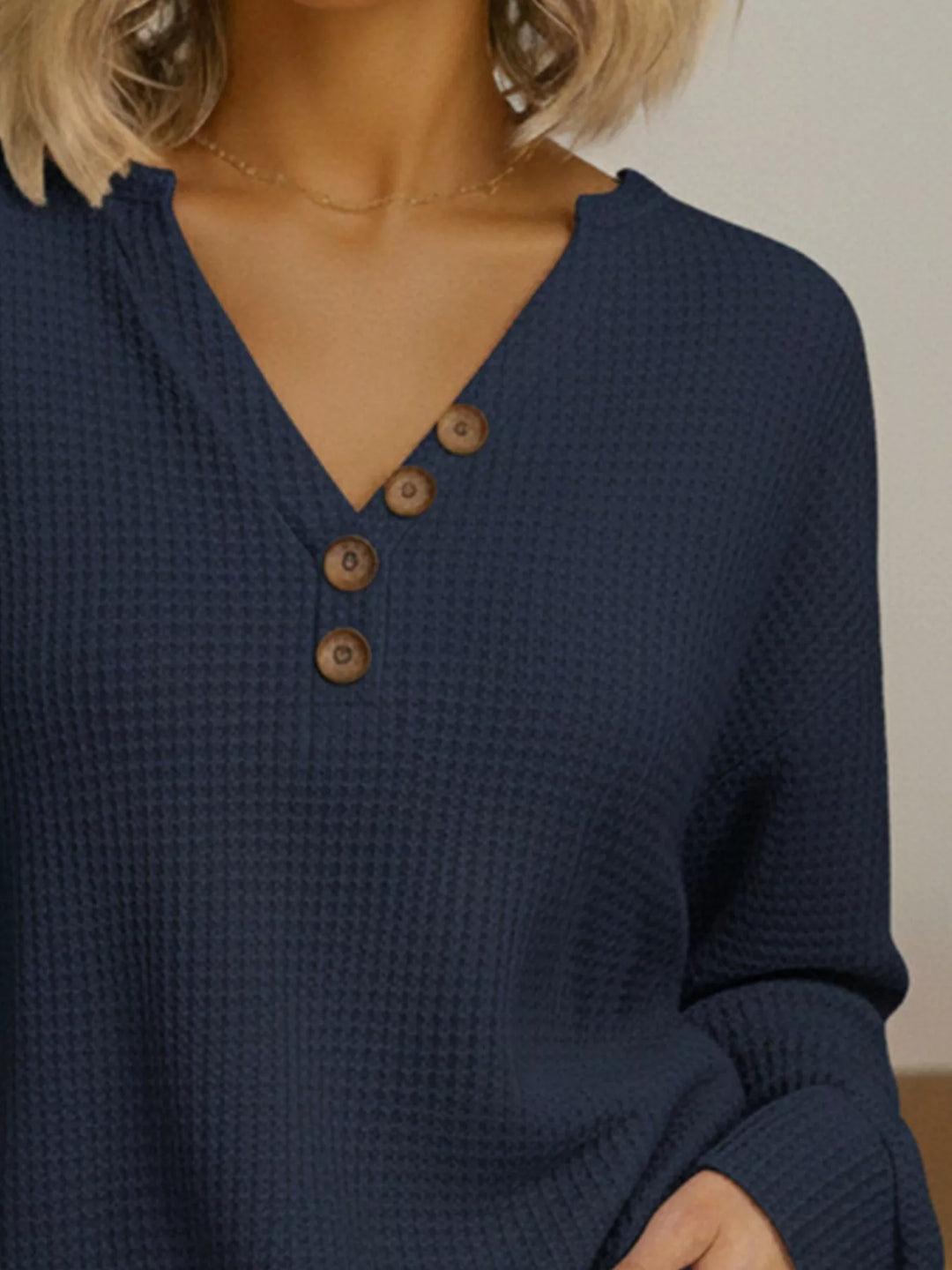 Waffle-knit long sleeve henley top with buttoned V-neck