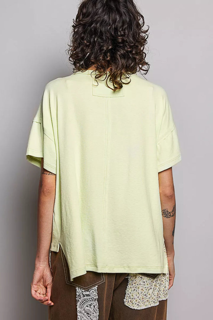 Relaxed short sleeve tee with high-low hem and exposed seams