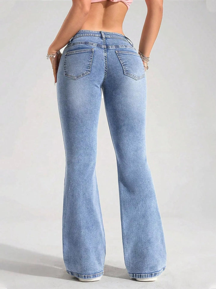Low-rise flare jeans with flap front pockets and faded wash