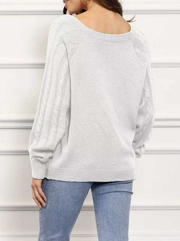 Cable knit boat neck sweater with side button trim