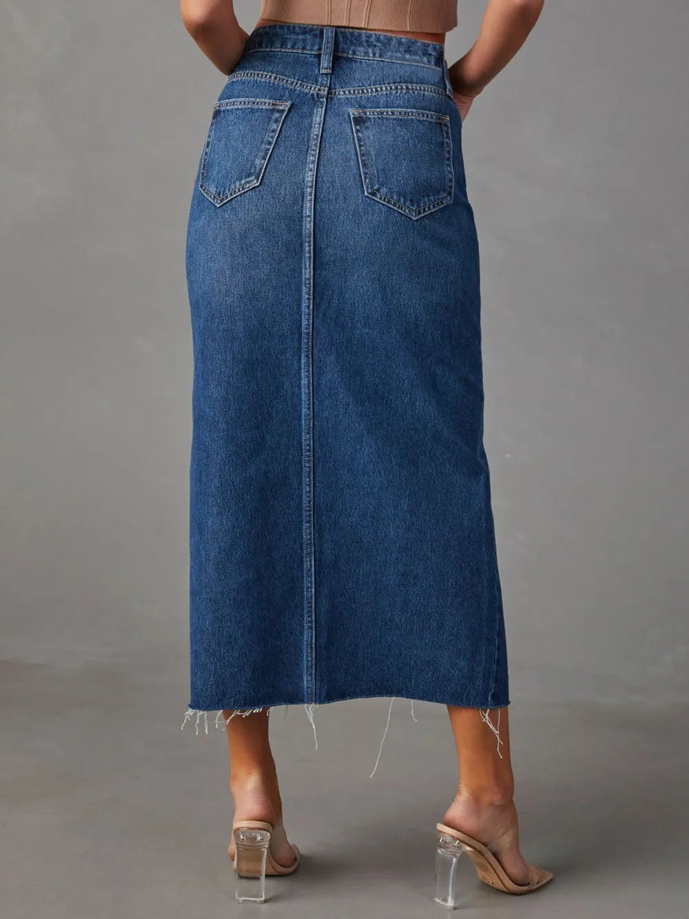 High-rise denim midi skirt with raw hem and front slit