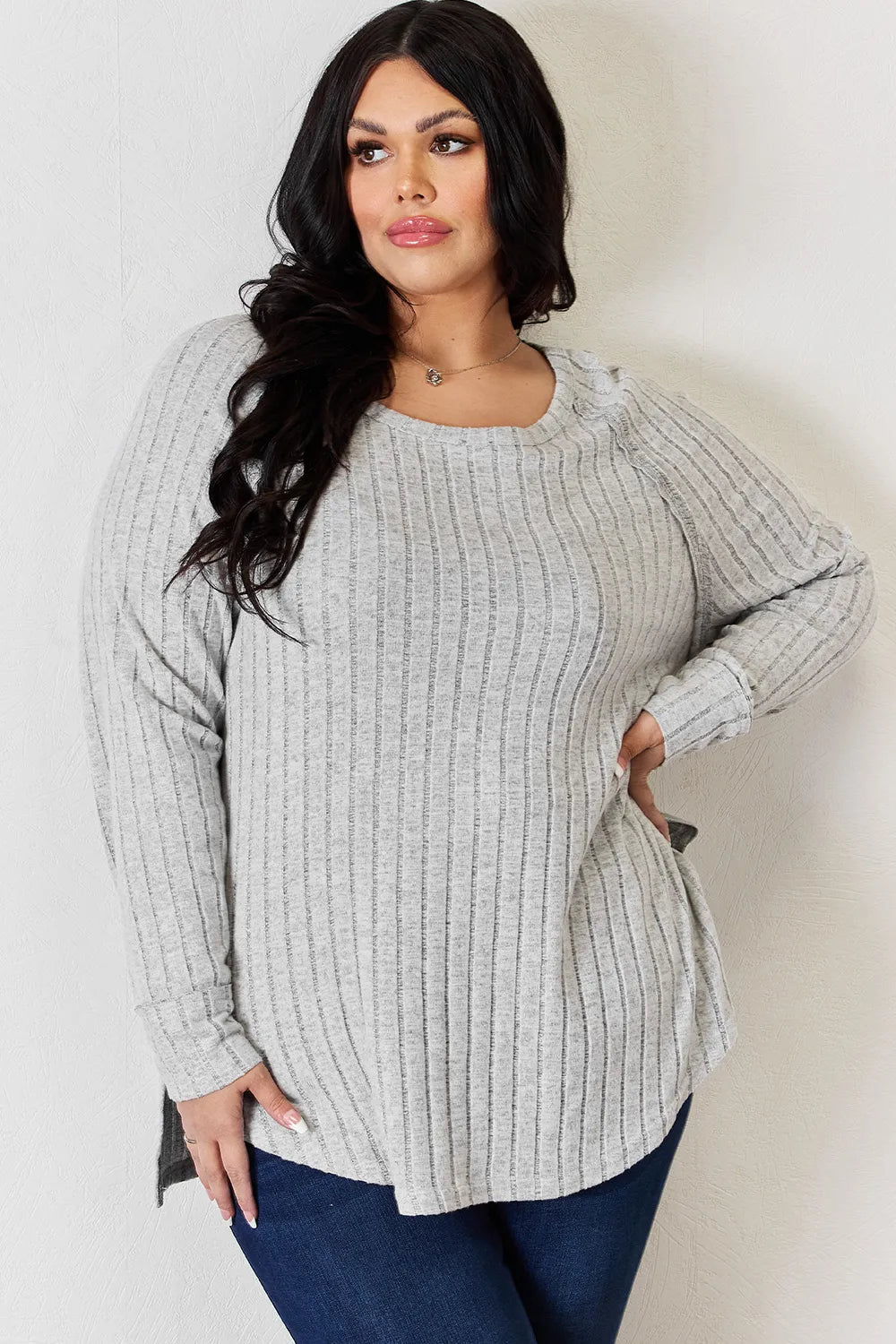 Ribbed knit round neck long sleeve top with side slits