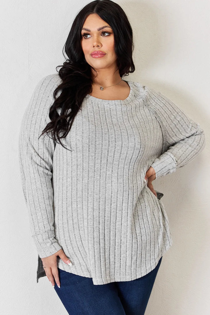 Ribbed knit round neck long sleeve top with side slits