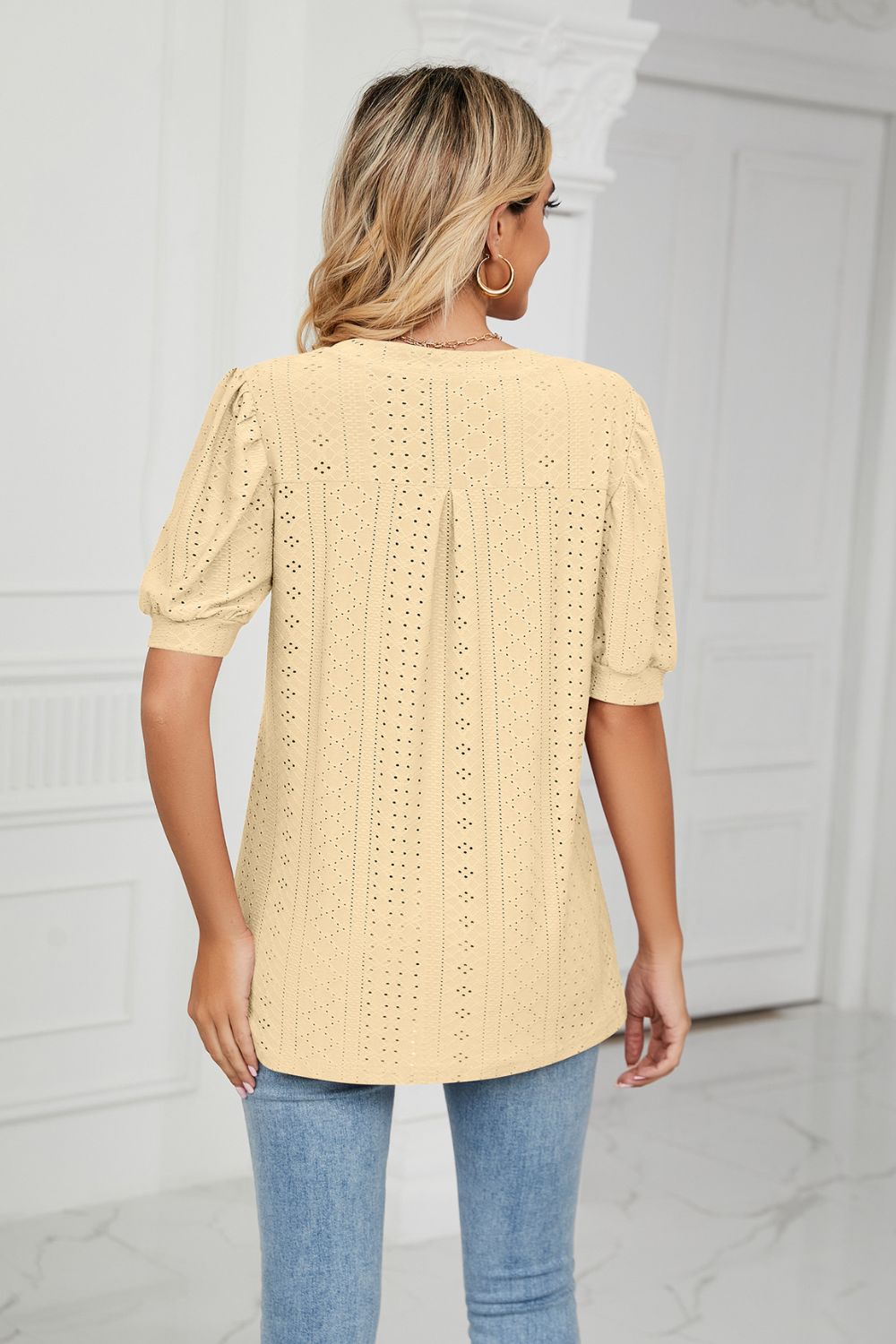 Eyelet puff sleeve top with notched V-neck