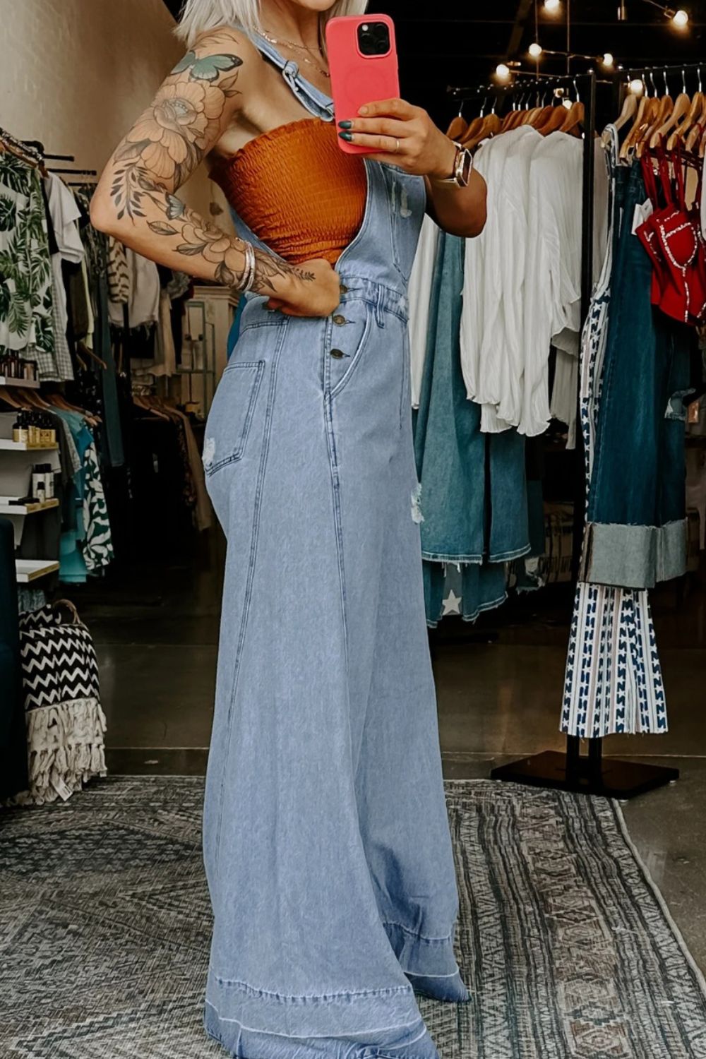 Distressed wide-leg denim overalls with adjustable straps