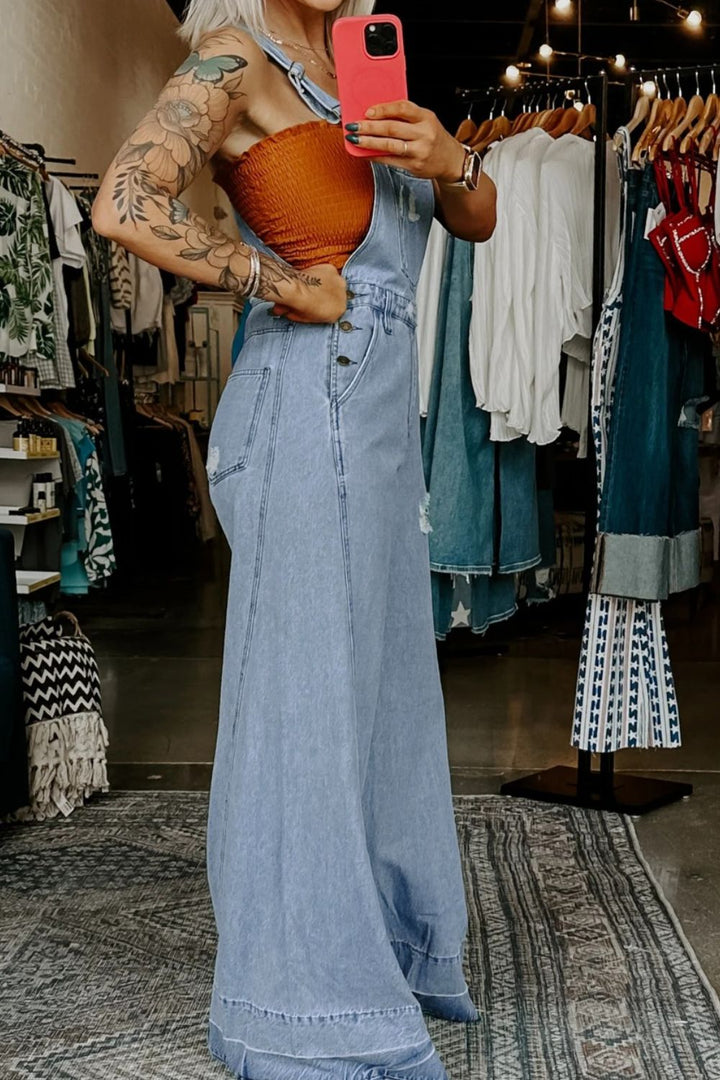 Distressed wide-leg denim overalls with adjustable straps