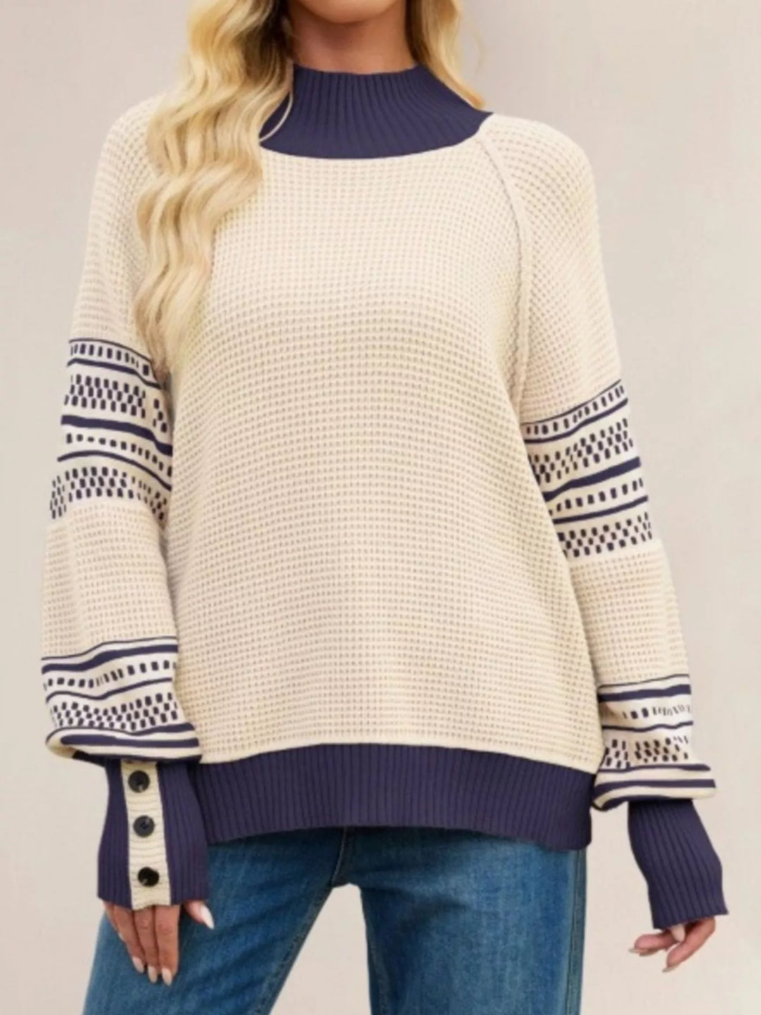 Cream Waffle knit mock neck sweater with geometric sleeve stripes
