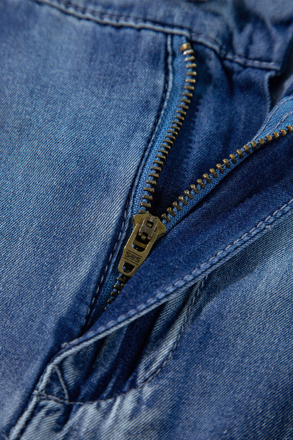 Pleated high-rise wide-leg jeans with deep pockets