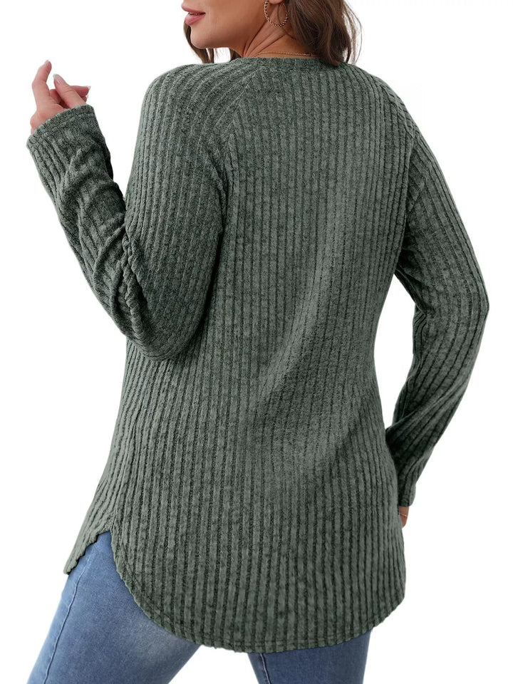 Ribbed knit crew neck long sleeve top with curved hem
