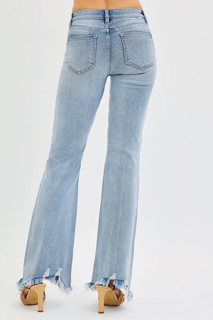 Mid-rise flare jeans with frayed raw hem and tummy control