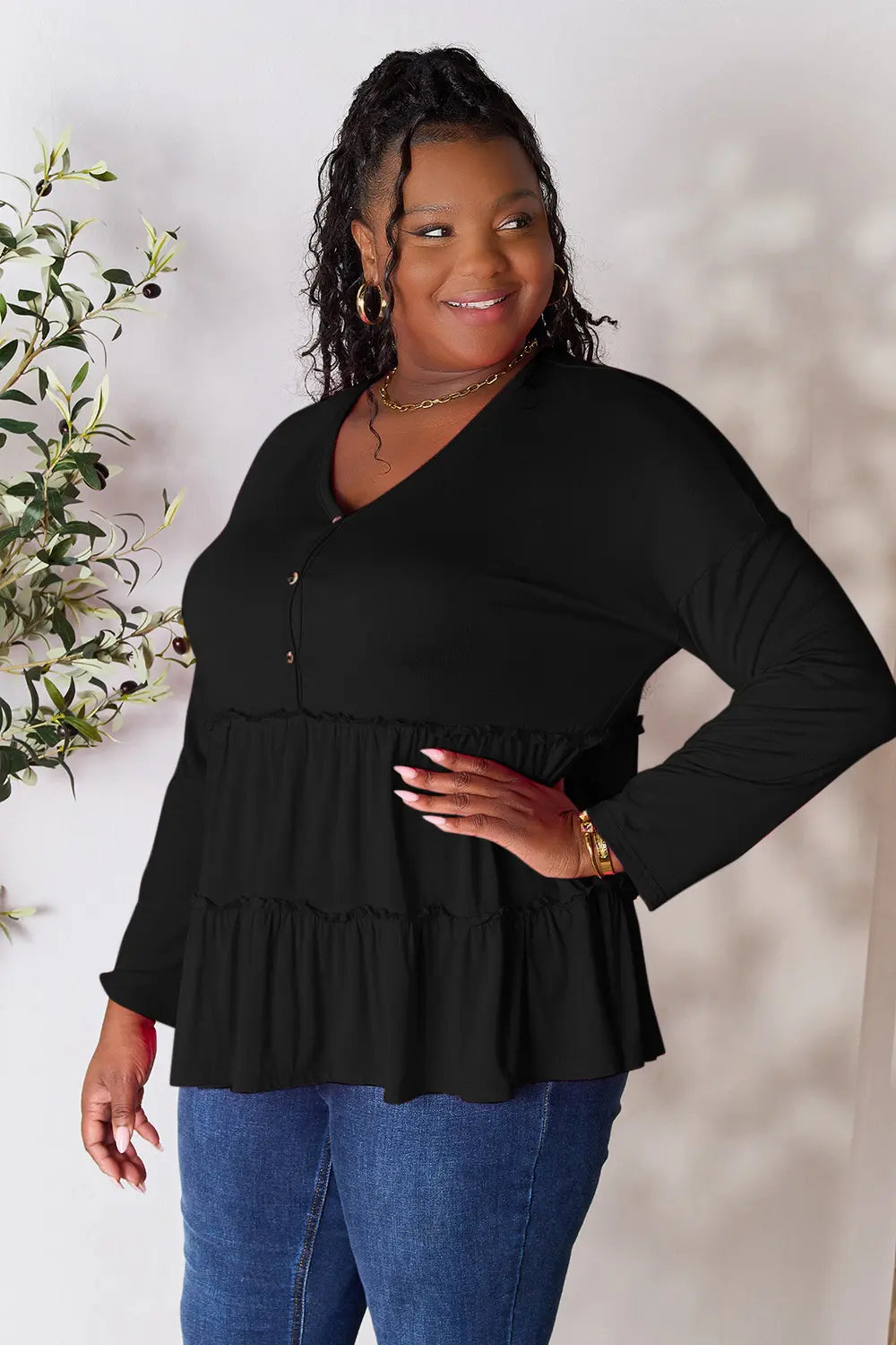 Half-button long sleeve blouse with tiered ruffle hem