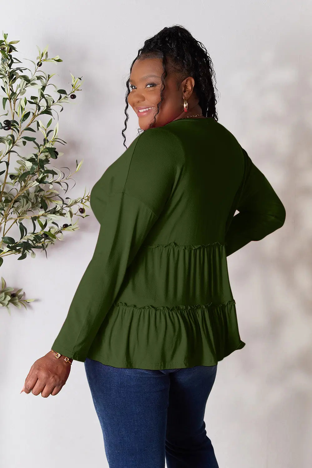 Half-button long sleeve blouse with tiered ruffle hem