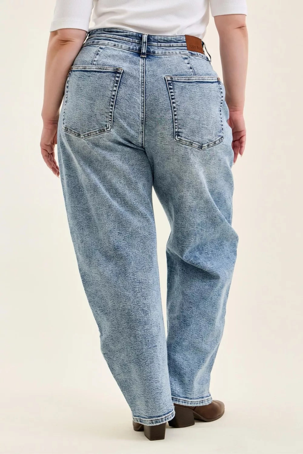 High-rise arc leg jeans with double waistband