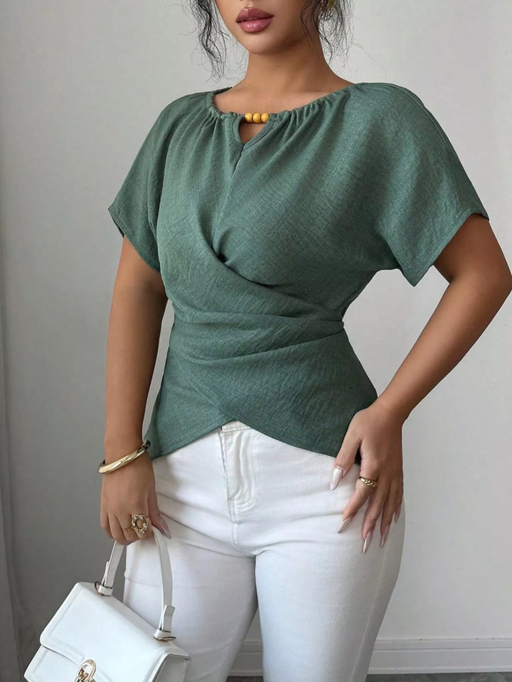 Wrap-front short sleeve blouse with beaded keyhole neckline