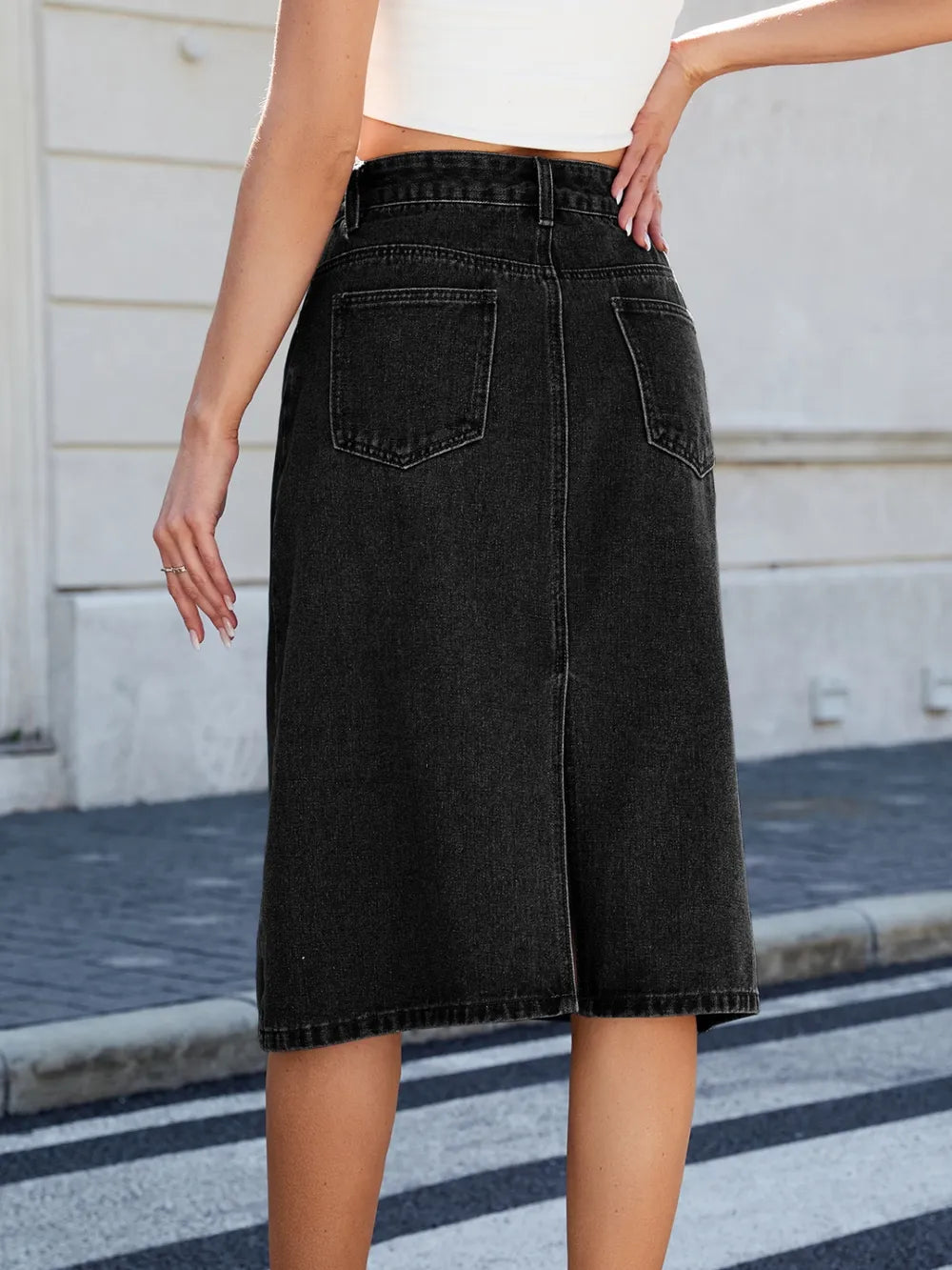High-rise midi denim skirt with back slit and front pockets