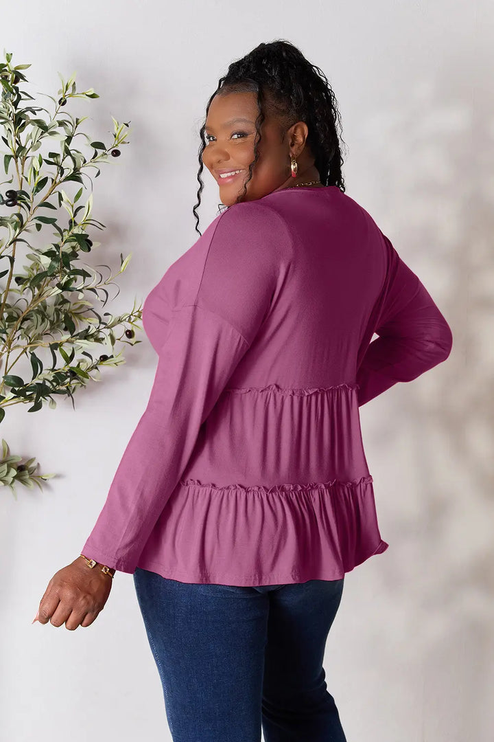 Half-button long sleeve blouse with tiered ruffle hem