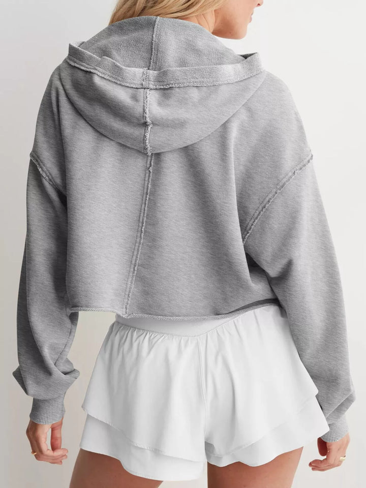 Cropped exposed-seam pullover hoodie with split neck