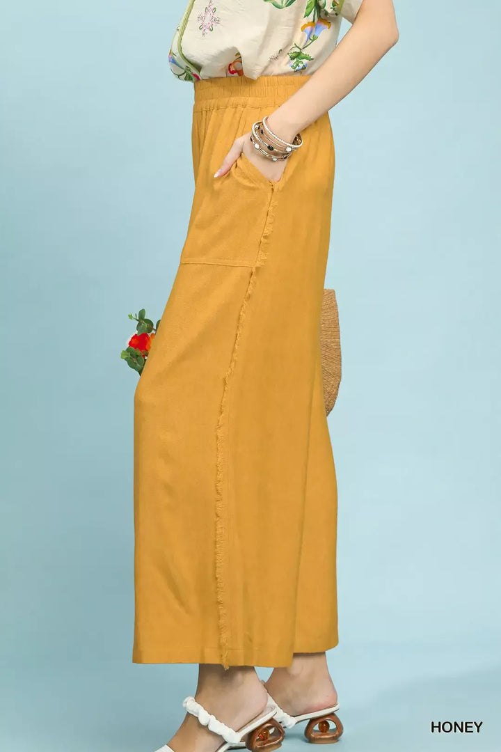 Wide-leg linen blend pants with frayed side trim and patch pockets