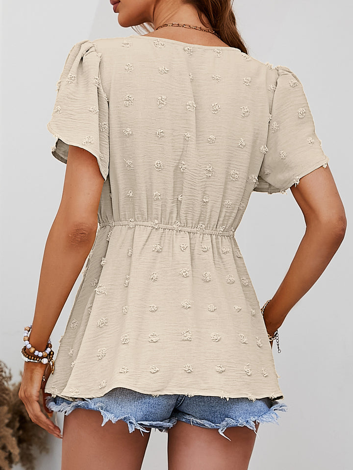 Swiss dot peplum blouse with flutter sleeves and button front