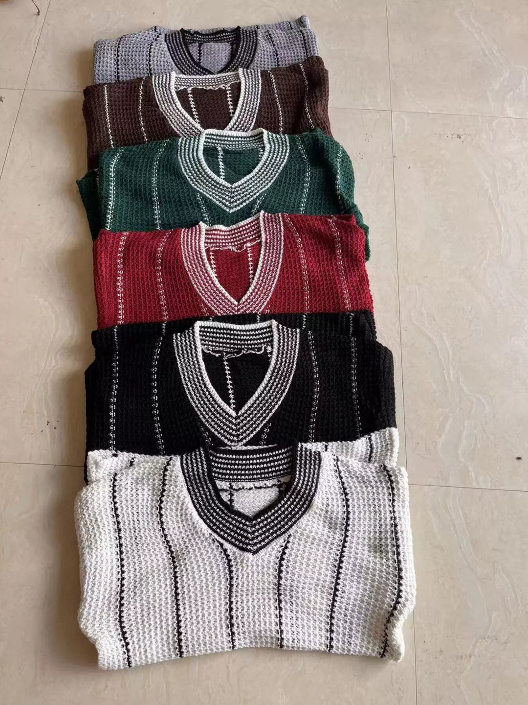 Waffle knit V-neck sweater with contrast stripe trim