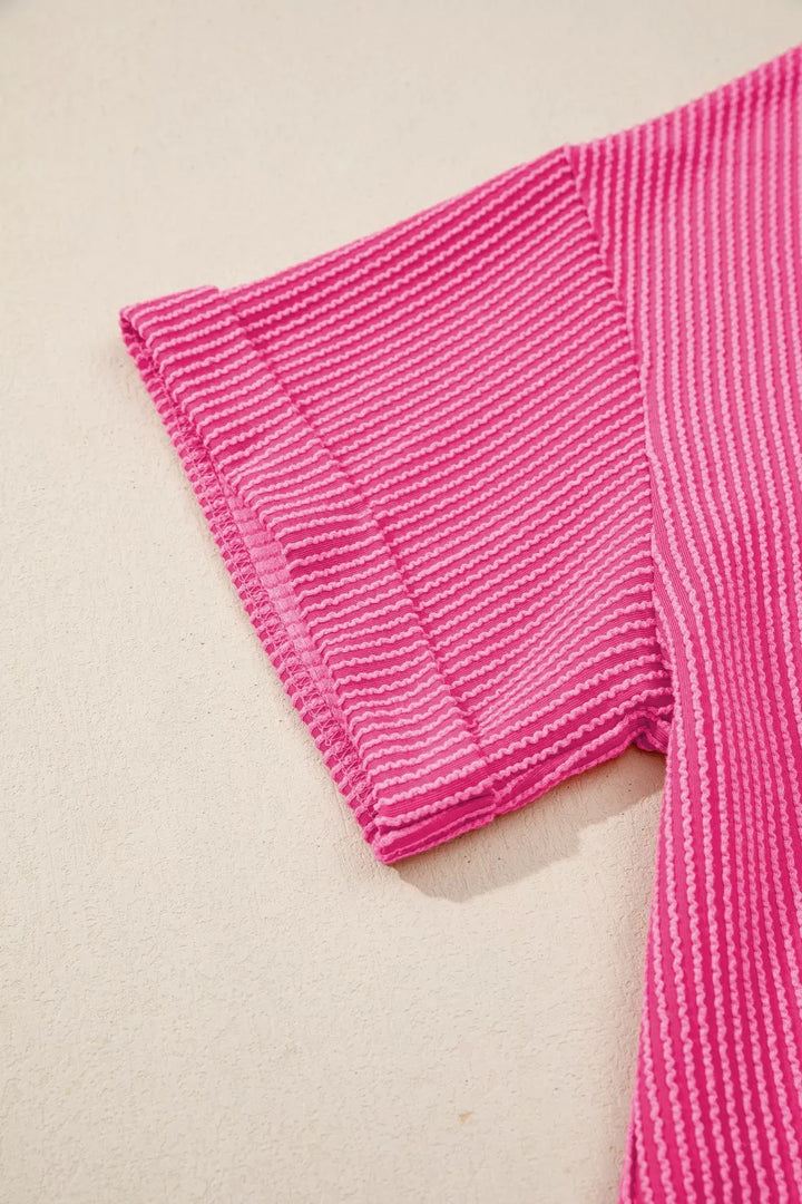 Ribbed knit short sleeve top with cutout bow-tie back