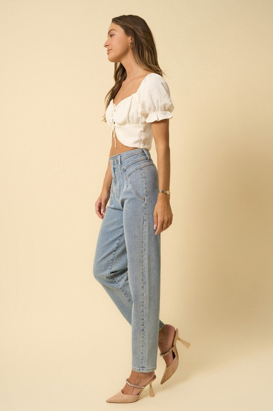 Avalon High-Rise Seamed Tapered Denim Jeans in LIGHT - cropped, high waist - detail view