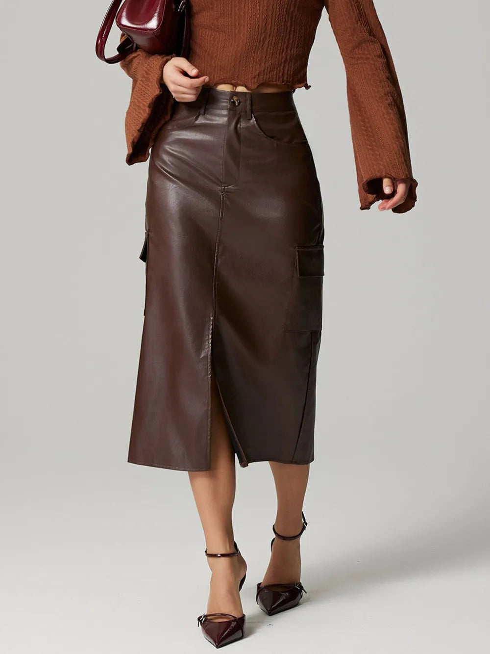 High-rise faux leather midi skirt with cargo pockets and slit