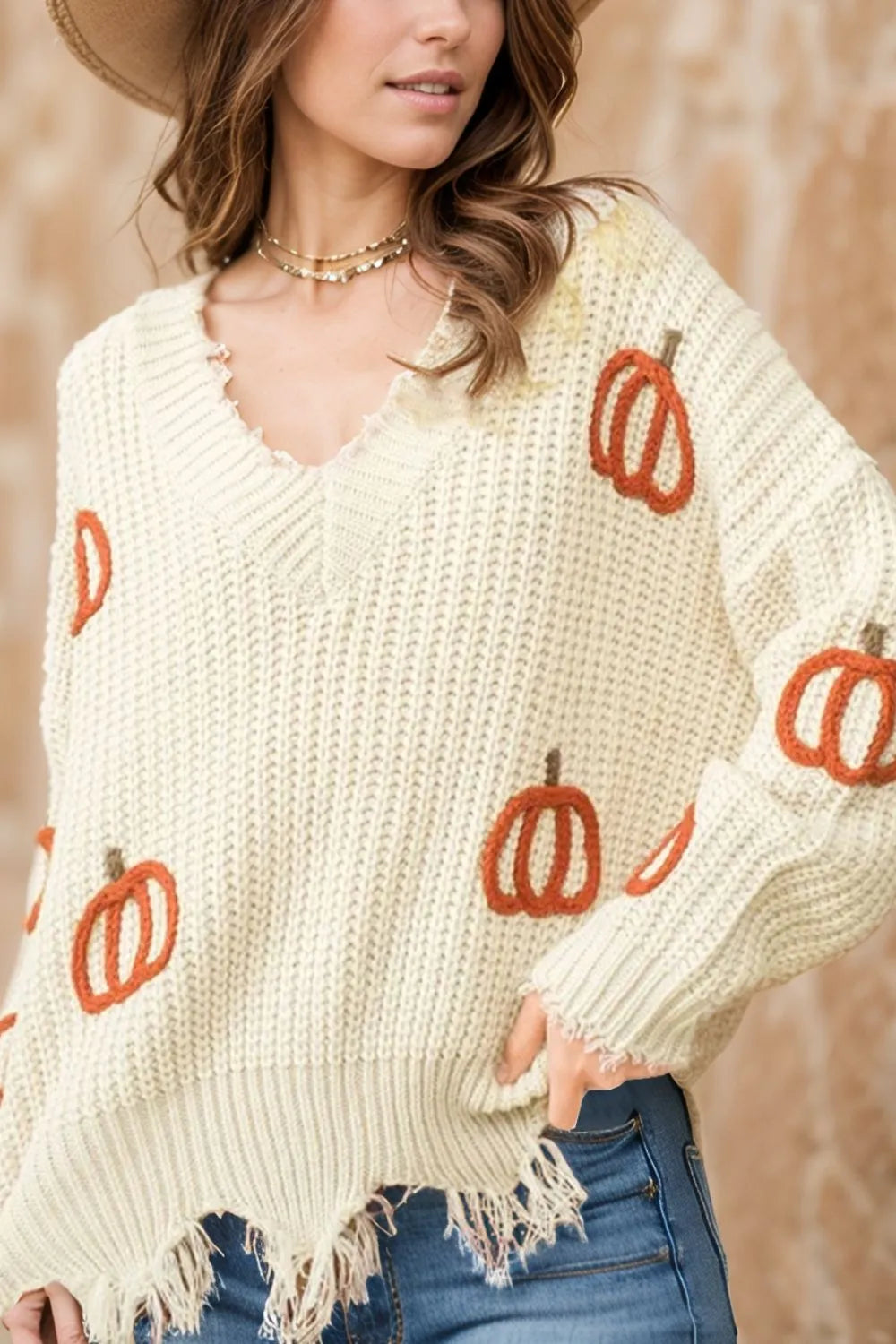 Pumpkin embroidered chunky knit sweater with frayed raw hem