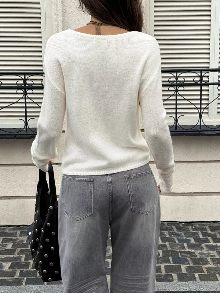 Boat neck dropped shoulder knit sweater with ribbed cuffs