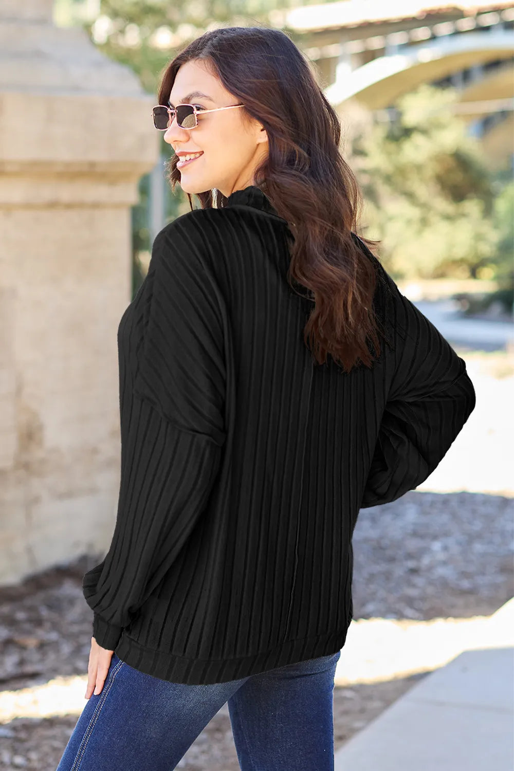 Ribbed exposed-seam mock neck knit top with drop shoulders