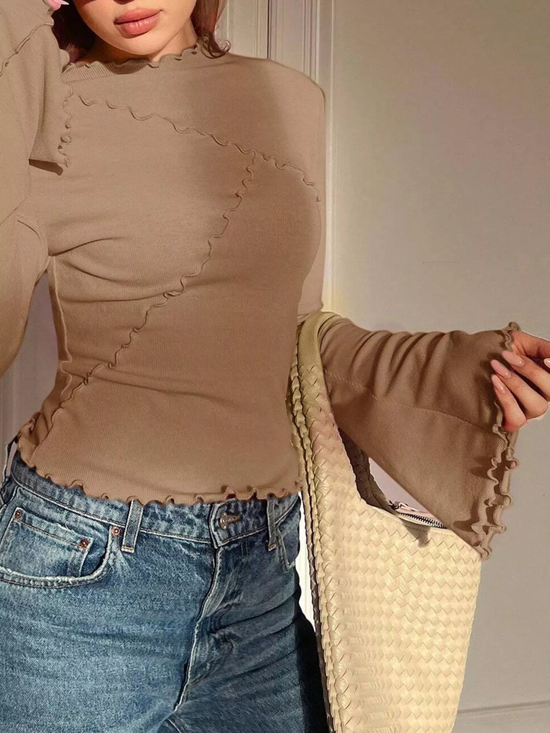 Ribbed knit mock neck top with lettuce-edge flare sleeves