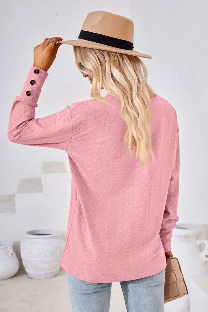 Textured knit V-neck long sleeve top with button cuffs