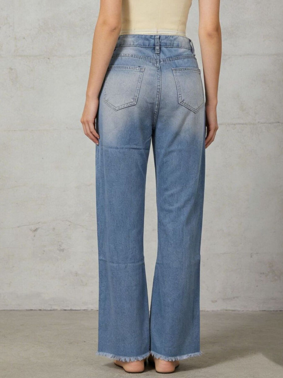 Distressed high-rise cropped bootcut jeans with raw hem
