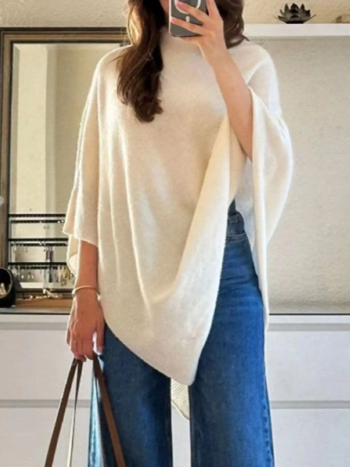 Turtleneck poncho sweater with asymmetric hem and batwing sleeves